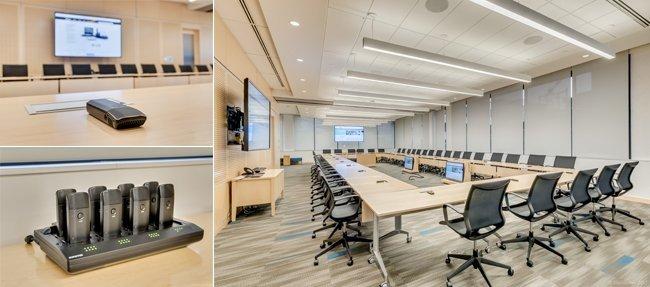 a conference room with a large table and chairs